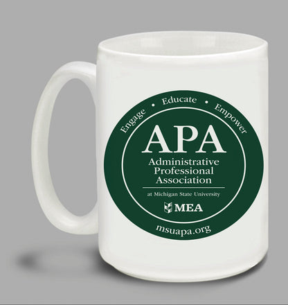 Two white mugs with green 'APA Administrative Professional Association' logos on a gray background.