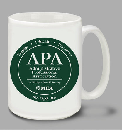 Two white mugs with green 'APA Administrative Professional Association' logos on a gray background.