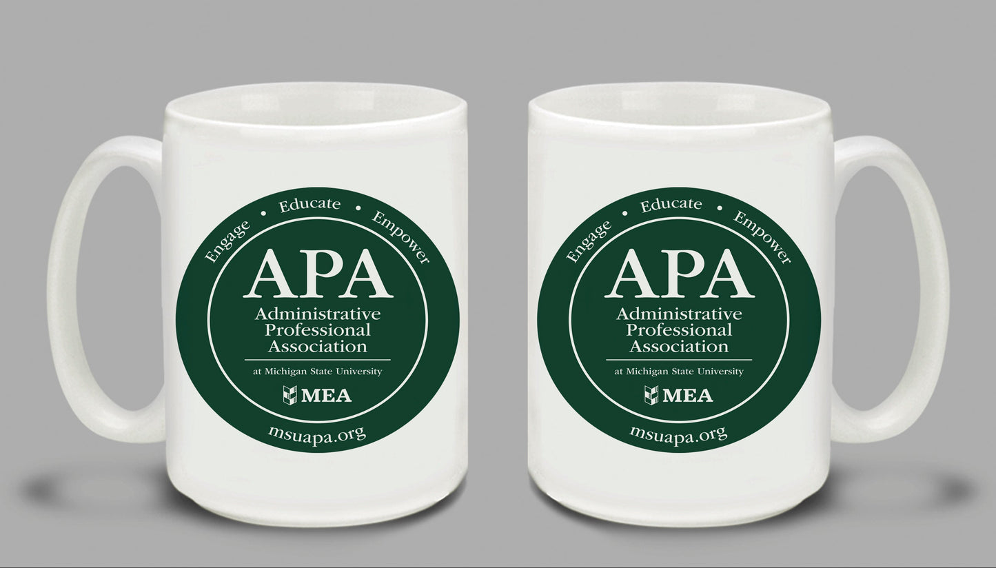 Two white mugs with green 'APA Administrative Professional Association' logos on a gray background.